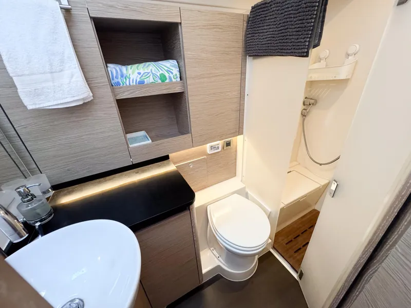 Slide: The Image of Modern bathroom in 2019 Hanse 588 yacht with sink, toilet, and shower. - 18