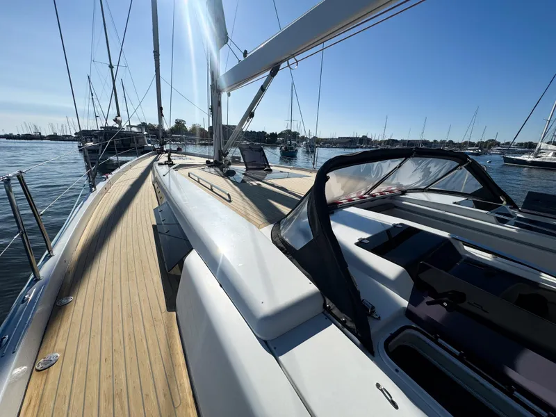 Slide: The Image of 2019 Hanse 588 yacht on calm water, sunny day, sleek deck design. - 2