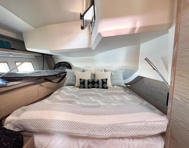 Slide: The Image of Luxurious bedroom interior of 2019 Hanse 588 yacht with modern design and cozy bedding. - 20