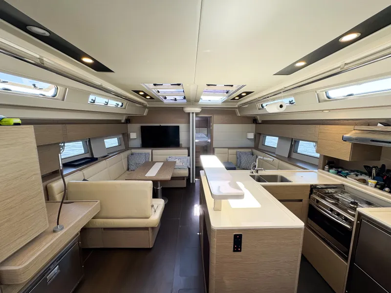 Slide: The Image of Luxurious interior of 2019 Hanse 588 yacht with modern kitchen and seating area. - 7