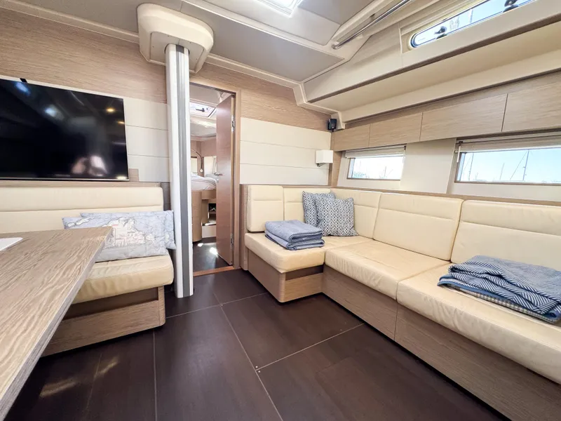 Slide: The Image of Luxurious interior of 2019 Hanse 588 yacht with beige seating and modern decor. - 8