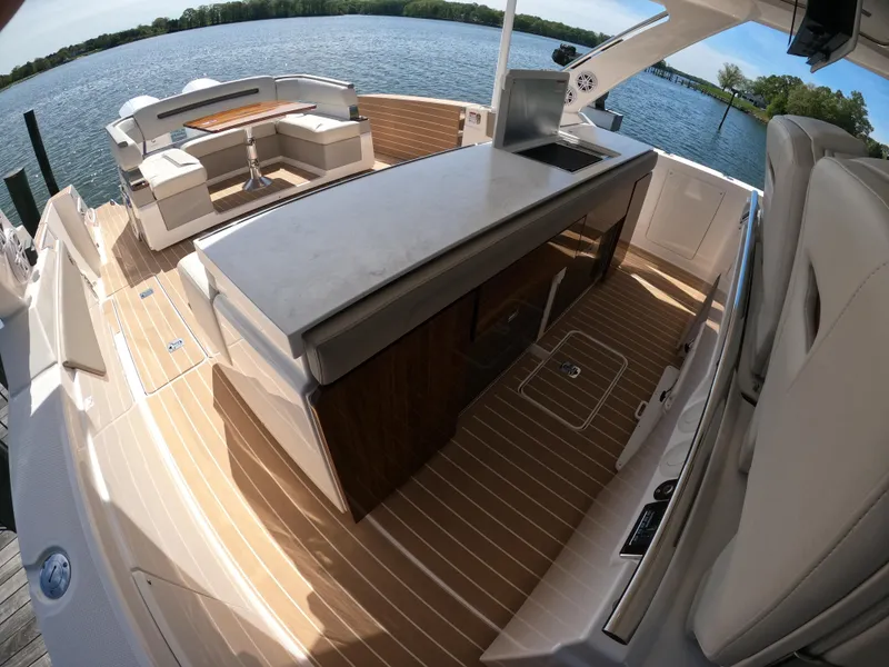 Slide: The Image of 2024 Tiara Yachts 43 LS luxury yacht interior with sleek design and waterfront view. - 15