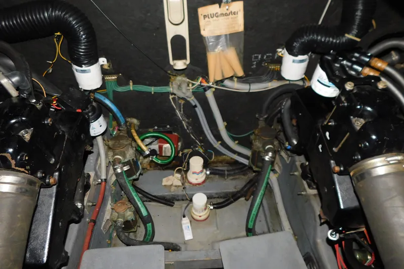 Slide: The Image of Engine room of 1986 Sea Ray 390 Express Cruiser with visible components and wiring. - 32