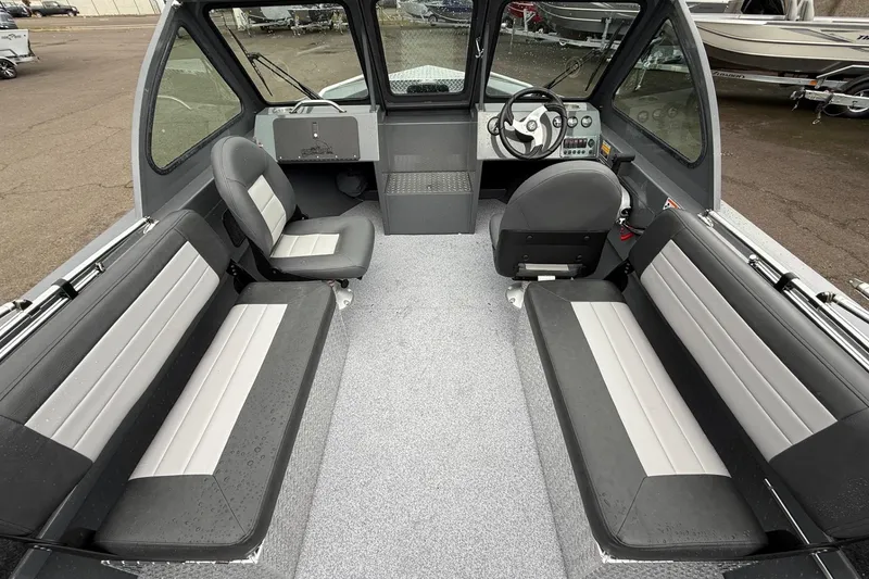 Slide: The Image of Interior of 2026 Fish Rite Sportsman 20 boat with seating and steering console. - 14