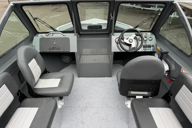 Slide: The Image of Interior of 2026 Fish Rite Sportsman 20 boat with seating and steering console. - 15