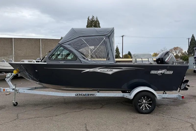 Slide: The Image of 2026 Fish Rite Sportsman 20 boat on trailer, featuring a sleek design and covered cabin. - 5