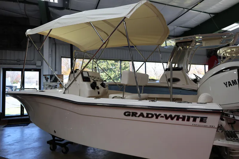 Slide: The Image of 2026 Grady-White Fisherman 180 boat interior with seating and console. - 8