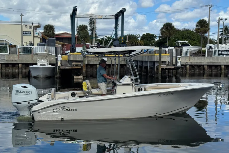 The Image of 2022 Sea Chaser 22 HFC boat with Suzuki engine at marina dock. - 0