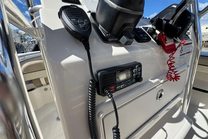 Slide: The Image of Control panel of 2022 Sea Chaser 22 HFC boat with radio and microphone. - 12