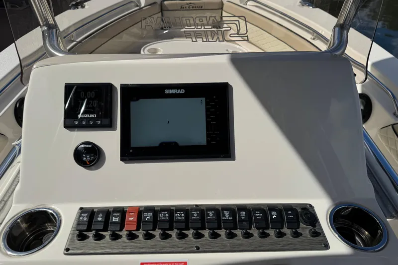 Slide: The Image of Control panel of 2022 Sea Chaser 22 HFC boat with Simrad display and switches. - 14