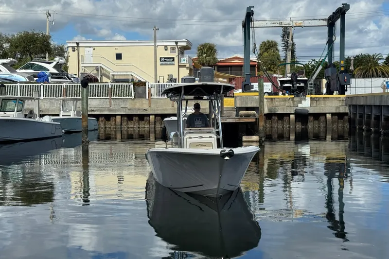 Slide: The Image of 2022 Sea Chaser 22 HFC boat docked at a marina under a partly cloudy sky. - 3