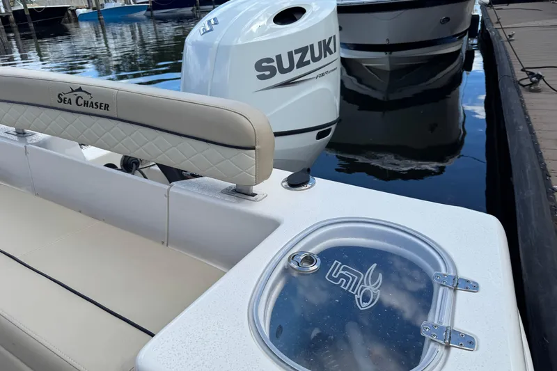 Slide: The Image of 2022 Sea Chaser 22 HFC boat with Suzuki outboard motor at dock. - 7