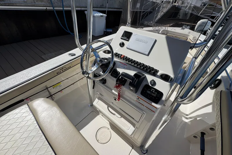 Slide: The Image of 2022 Sea Chaser 22 HFC boat console with steering wheel and controls. - 8