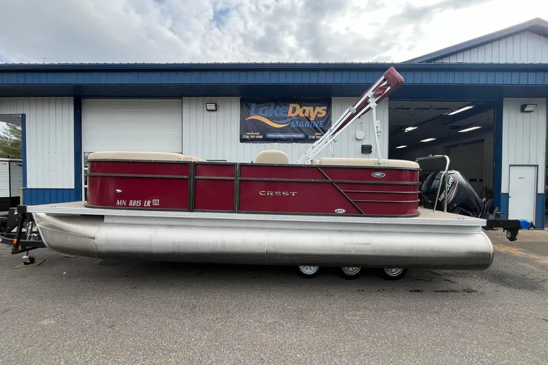 The Image of 2017 Crest I 220 L pontoon boat in front of Lake Days Marine building. - 1