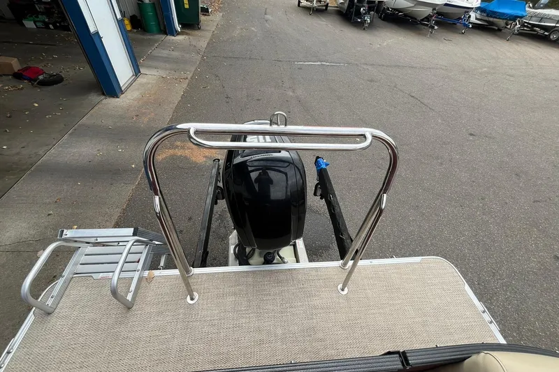 Slide: The Image of 2017 Crest I 220 L pontoon boat with outboard motor and boarding ladder. - 14