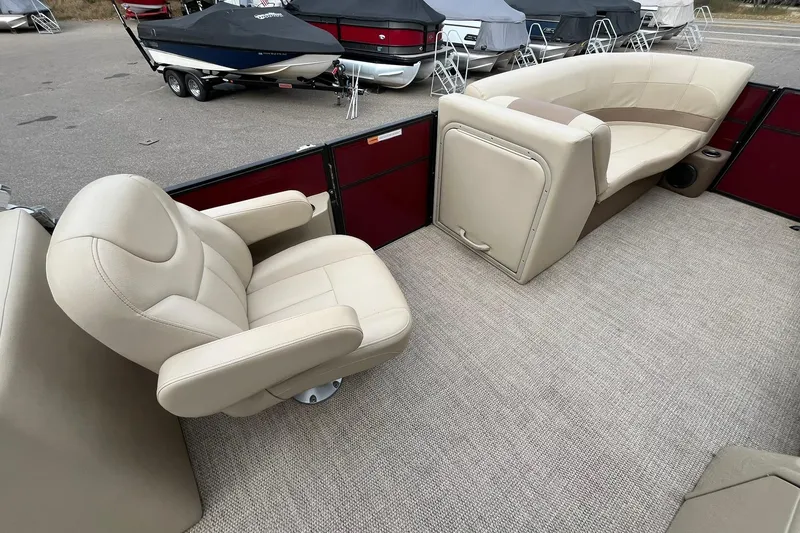 Slide: The Image of 2017 Crest I 220 L boat interior with beige seating and carpeted floor. - 21