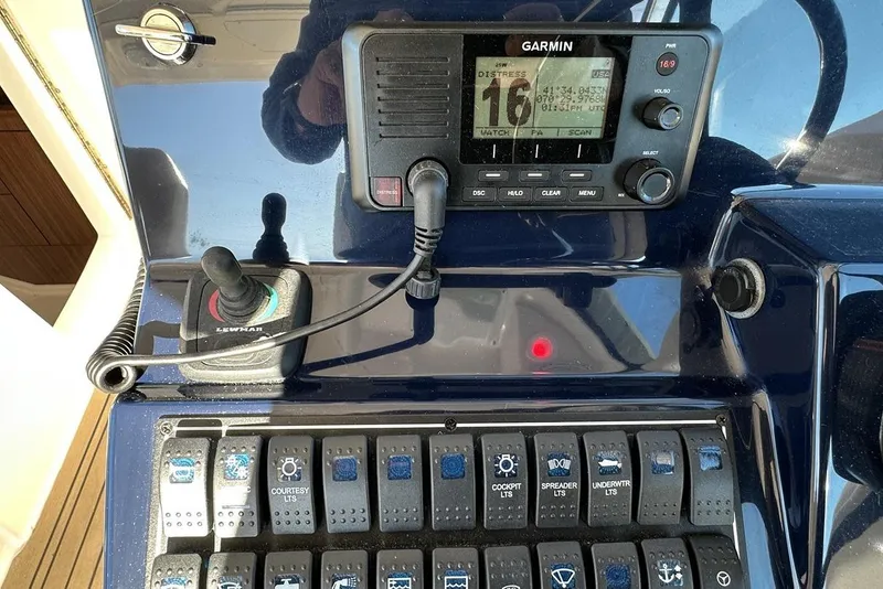 Slide: The Image of Control panel of a 2016 Pursuit DC 325 Dual Console boat with Garmin display. - 26