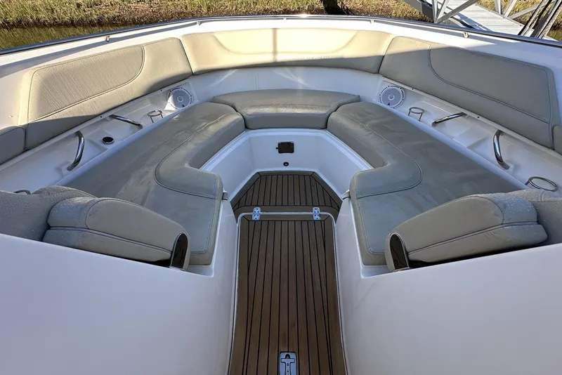 Slide: The Image of 2016 Pursuit DC 325 Dual Console boat interior with cushioned seating and teak flooring. - 28