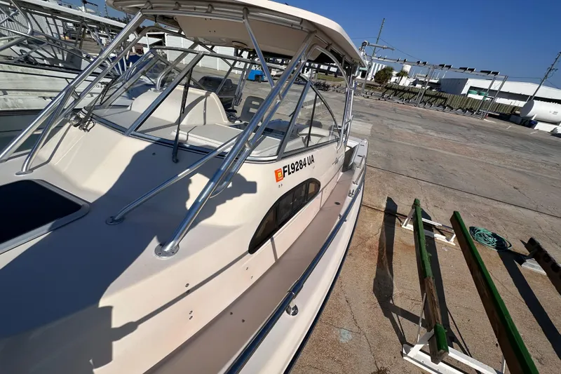 Slide: The Image of 2007 Grady-White Marlin 300 boat docked, showcasing sleek design and sturdy construction. - 10