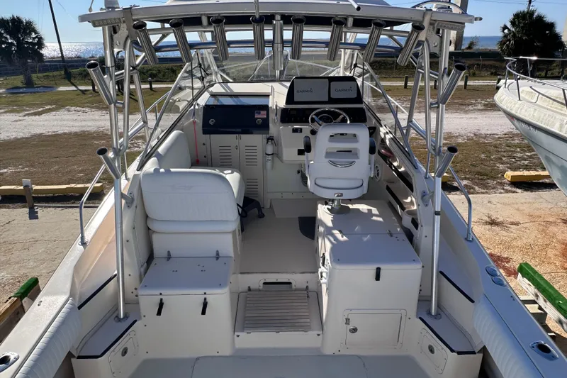 Slide: The Image of 2007 Grady-White Marlin 300 boat interior with helm and seating area. - 21