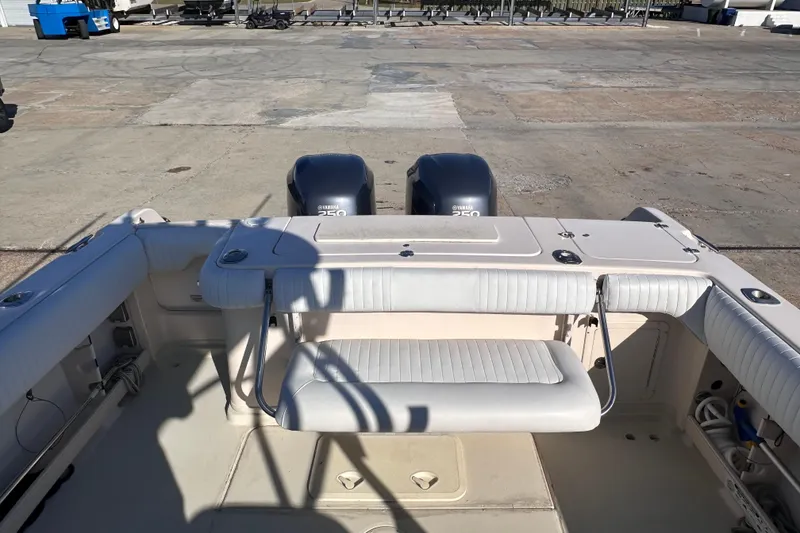 Slide: The Image of 2007 Grady-White Marlin 300 boat with Yamaha 250 engines at a marina. - 23