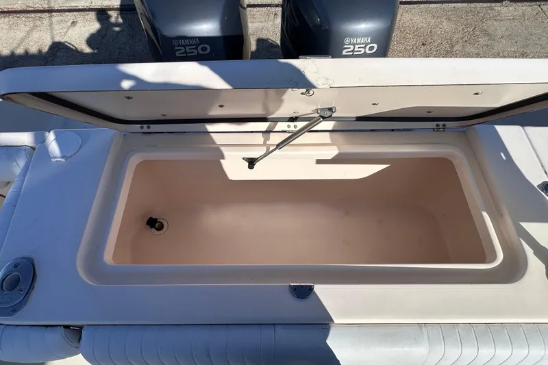 Slide: The Image of Open storage compartment on 2007 Grady-White Marlin 300 boat with Yamaha 250 engines. - 25
