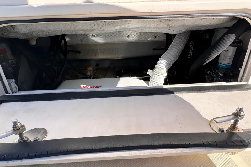Slide: The Image of 2007 Grady-White Marlin 300 engine compartment with "No Step" warning label. - 28