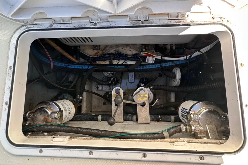 Slide: The Image of 2007 Grady-White Marlin 300 engine compartment with visible wiring and components. - 29