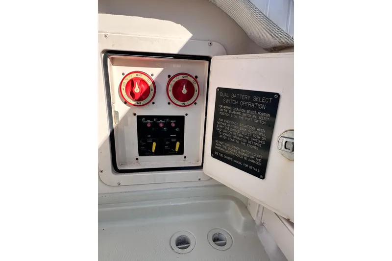 Slide: The Image of 2007 Grady-White Marlin 300 dual battery switch panel with operation instructions. - 30