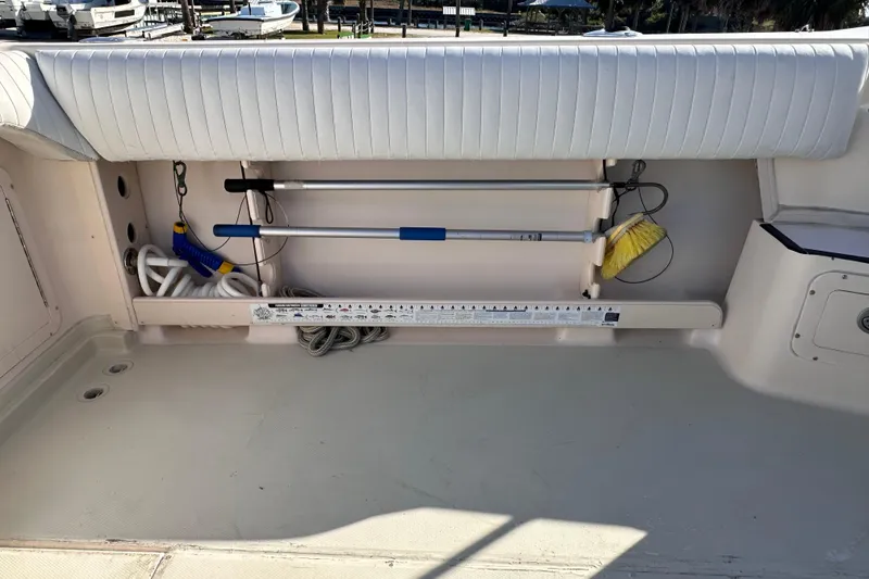Slide: The Image of 2007 Grady-White Marlin 300 boat deck with cleaning tools and storage area. - 31