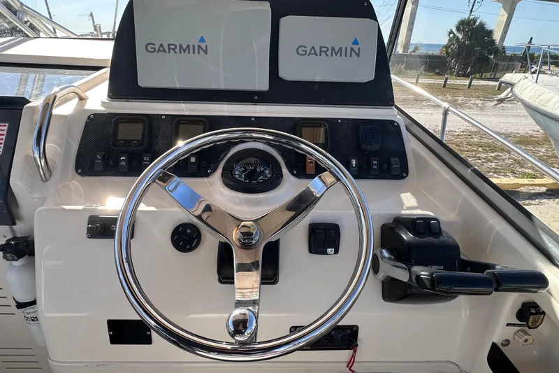 Slide: The Image of 2007 Grady-White Marlin 300 helm with Garmin navigation and Yamaha controls. - 43