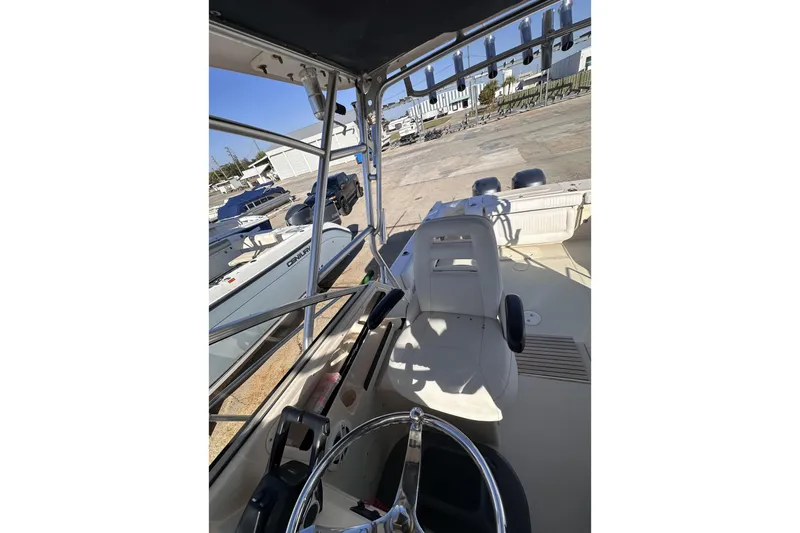 Slide: The Image of 2007 Grady-White Marlin 300 boat interior with steering wheel and seating area. - 45