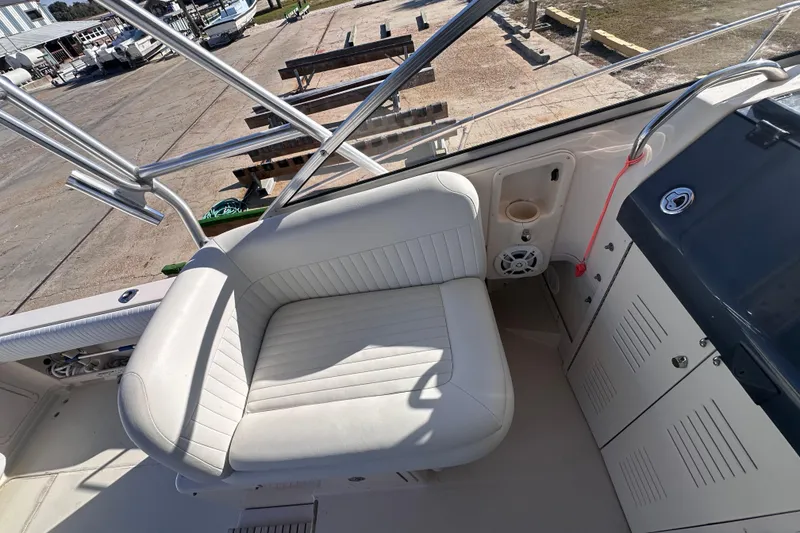 Slide: The Image of 2007 Grady-White Marlin 300 boat interior with white seating and storage compartments. - 47