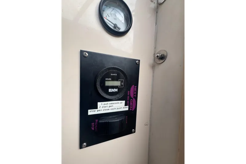 Slide: The Image of Control panel on a 2007 Grady-White Marlin 300 boat, featuring gauges and instructions. - 55