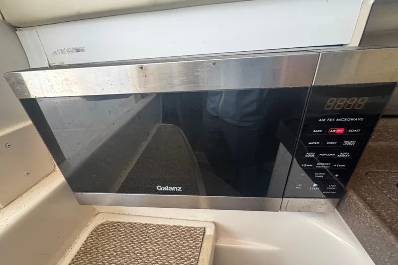 Slide: The Image of Galanz microwave inside a 2007 Grady-White Marlin 300 boat kitchen area. - 57