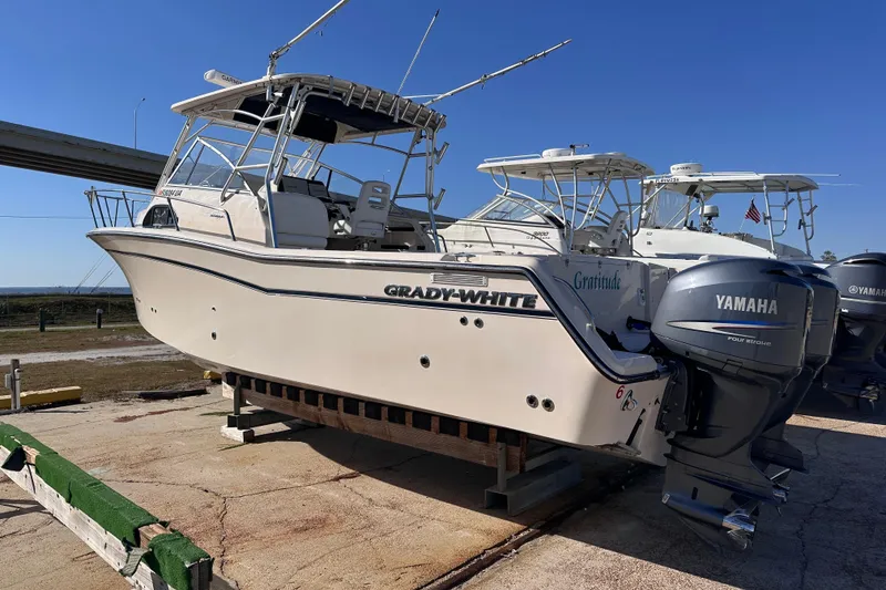 Slide: The Image of 2007 Grady-White Marlin 300 boat with Yamaha engines on a dock. - 6