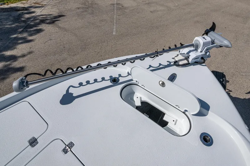 Slide: The Image of 2026 Yellowfin 24 Bay CE boat deck with trolling motor and storage compartment. - 16