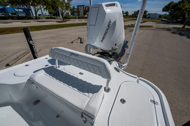 Slide: The Image of 2026 Yellowfin 24 Bay CE boat with Mercury engine, featuring sleek white seating. - 20