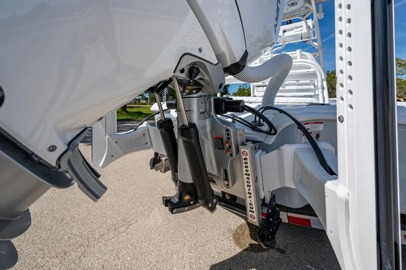 Slide: The Image of 2026 Yellowfin 24 Bay CE boat engine and hydraulic system close-up. - 24