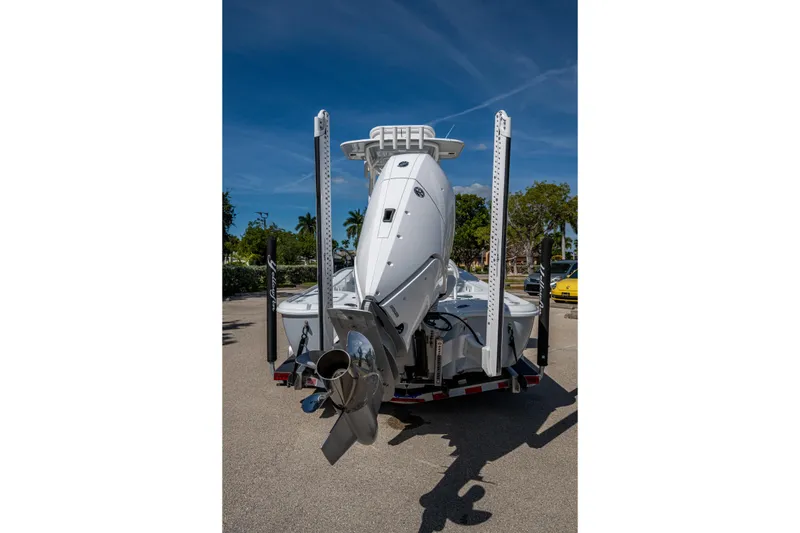 Slide: The Image of 2026 Yellowfin 24 Bay CE boat on trailer, rear view with outboard motor. - 28