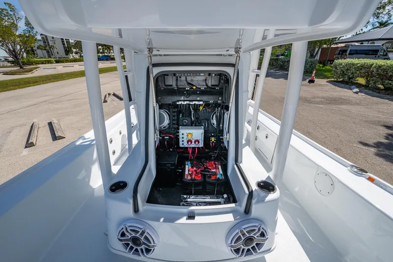 Slide: The Image of 2026 Yellowfin 24 Bay CE boat interior with open console, showcasing wiring and components. - 5
