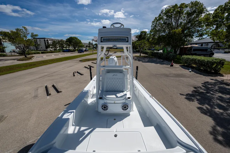 Slide: The Image of 2026 Yellowfin 24 Bay CE boat on trailer in sunny parking lot. - 6