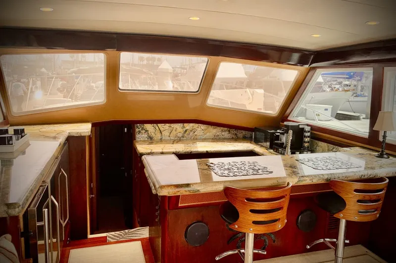 Slide: The Image of Luxurious interior of a 1984 Egg Harbor 48' Flybridge yacht with elegant wood and marble finishes. - 7