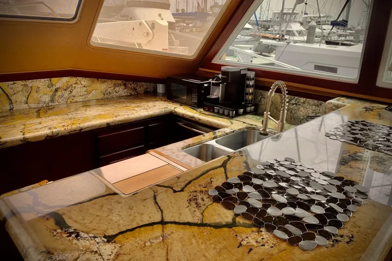Slide: The Image of Luxurious kitchen interior of 1984 Egg Harbor 48' Flybridge yacht with granite countertops. - 9