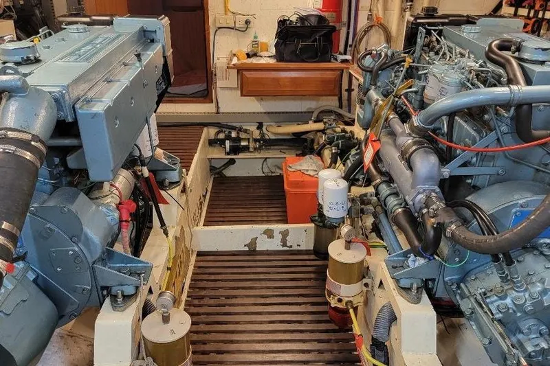 Slide: The Image of Engine room of a 1998 DeFever 44 Sundeck Trawler with dual engines. - 24