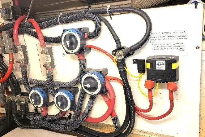 Slide: The Image of Electrical panel of a 1998 DeFever 44 Sundeck Trawler with wiring and switches. - 30