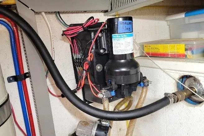 Slide: The Image of Engine room of 1998 DeFever 44 Sundeck Trawler with installed water pump system. - 31