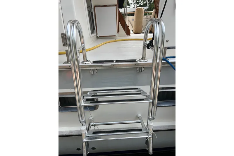 Slide: The Image of Stainless steel ladder on 1998 DeFever 44 Sundeck Trawler yacht. - 37