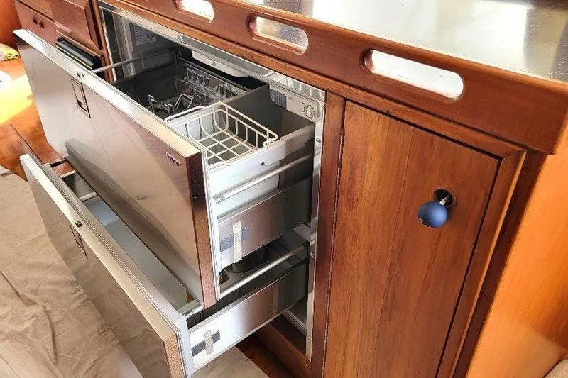 Slide: The Image of Open stainless steel drawers in a 1998 DeFever 44 Sundeck Trawler kitchen. - 8
