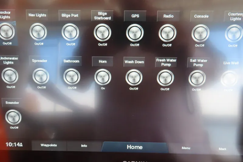 Slide: The Image of Touchscreen control panel on a 2007 Deep Impact 36 boat, displaying various system toggles. - 15